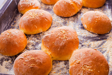 Close-up hot buns with sesame seeds on top