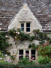 A stone cottage in Bibury town, Cotswolds, England, UK