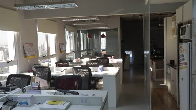 afro brazilian business woman working alone in empty modern office