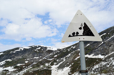 danger falling rock sign on mountain
