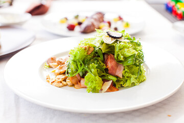 Close-up green salad with fried bacon and mushrooms