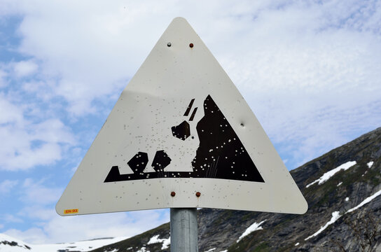 Danger Falling Rock Sign On Mountain