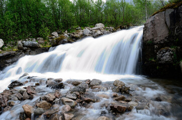 Obraz premium majestic mountain waterfall in northern norway