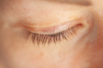 Close-up of a woman's eye. Blue beautiful eyes without makeup