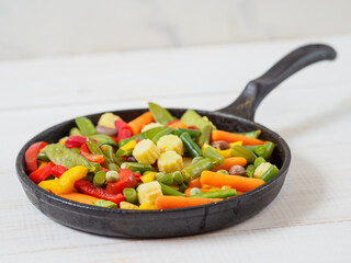 Fresh vegetables fried in the pan.