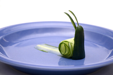 A caracol made of cucumber isolated on white background. Funny animal made of vegetable, ideas for kids plate decoration