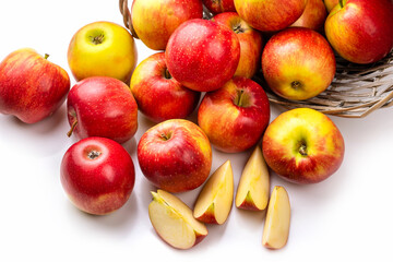 Red-yellow apples and a basket. Isolate on white background