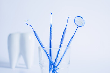 Dentistry tools for teeth dental care and treatment on white background. White dental tooth model.