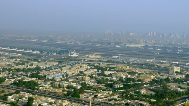 Dubai Airport terminal beautiful aerial view shoot over the 8k parallax during afternoon revealing the airport and his surroundings