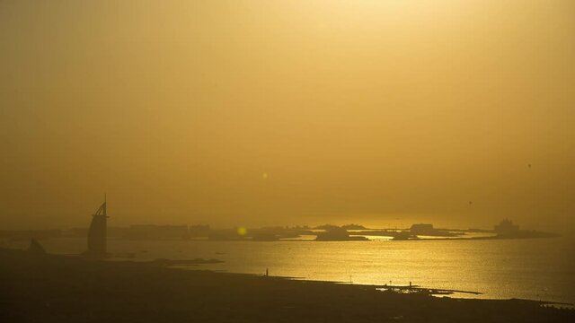 Distant View Of Burj Al Arab Hotel and the Palm island during Sunrise