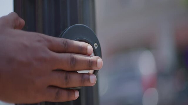 Black Hand Presses Pedestrian Push to Walk Button, Slow Motion, Close Up