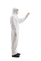 Man in a hazmat suit holding a cotton swab test
