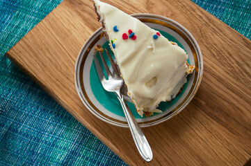 Chocolate sponge cake with cream  on a saucer