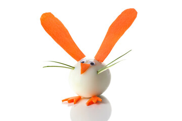 Food art creative concepts. A bunny rabbit with big ears made with boiled eggs, carrots and raisins eyes over white background.