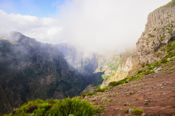 Mountain landscape. View of mountains and fog on the route Pico Areeiro - Pico Ruivo, Madeira