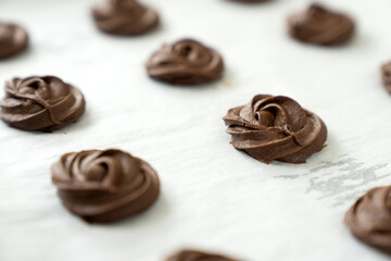 Homemade simple dark or brown chocolate cookies in baking tray