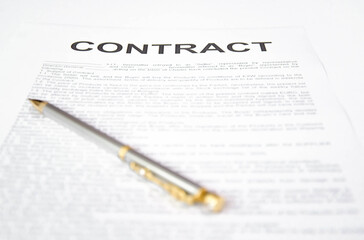  pen and contract on a white background. signing a contract
