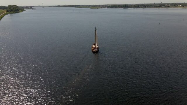 inspiring Aerial of boat slowly sailing over sea