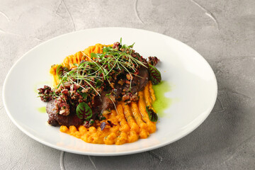 pumpkin mashed with beef and microgreen closeup