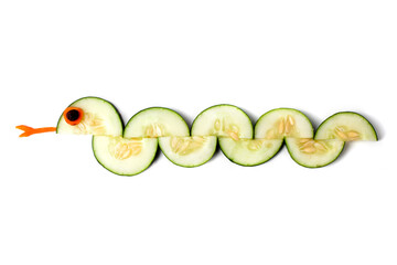 Food art creative concepts. Cute snake made of cucumber and carrots isolated on a white background.