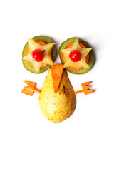 Food art creative concepts.Weird creature made of pear, tomatoes, star fruit, kiwi and carrots isolated on white background.