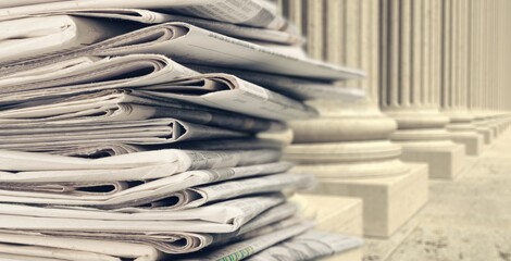 Pile of newspapers stacks on blur background