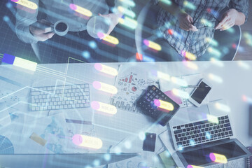 Double exposure of man and woman working together and data theme hologram drawing. Computer background. Top View.