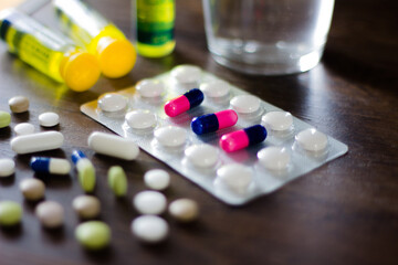 In this photo illustration pharmaceutical pills are seen displayed on a table. Dexamethasone, Hydroxychloroquine are used to treat coronavirus (COVID-19) disease.