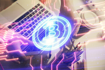 Double exposure of woman hands typing on computer and crypto market theme hologram drawing....