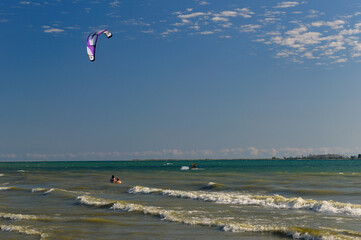 Wind surfer and bathers at Popham Bay beach at Presquile Provincial Park Brighton Ontario