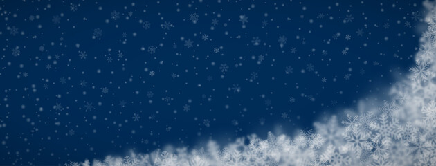 Christmas background of snowflakes of different shapes, sizes, blur and transparency on dark blue background