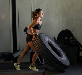 Obraz na płótnie Canvas lifting tires in the gym