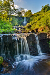 Fototapeta na wymiar Cascade Waterfall in the Forest