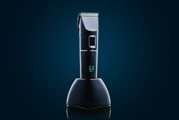 Electric hair clipper or shaver on a dark background