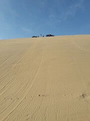 Fototapeta na wymiar Huacachina Peru desert oasis and sand dunes 2019 sand boarding