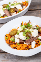 sweet potato steak poutine dish