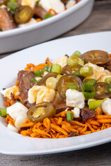 sweet potato steak poutine dish