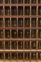Retro keys in wooden storage, hotel reception, old vintage style, all keys in a place