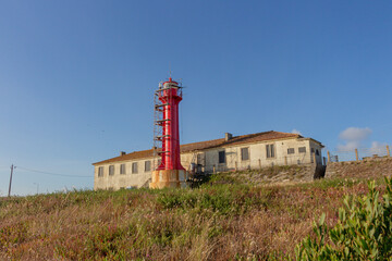 Fototapeta na wymiar Conservation and restoration work taking place on the Farol de Esposende (Esposende Lighthouse) set in front of the Fort of Sao Joao Baptista de Esposende, situated at the mouth of Cavado river.
