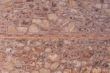 red brick wall with horizontal lines.