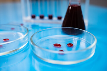 Blood samples and pipette on Petri Dishes. Blood test