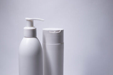  two white shampoo bottles and no label. body care and beauty concept. Copy space. High quality photo