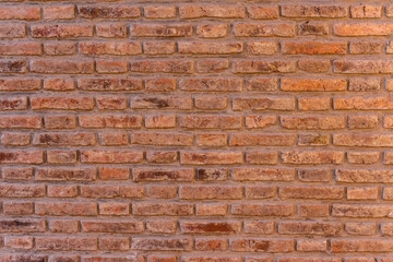 Red and orange old brick wall. Vintage brick wall. Background and texture.