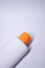 a yellow shampoo bottle with yellow neck and no label. body care and beauty concept. Copy space....