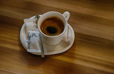 cup of coffee on wooden table