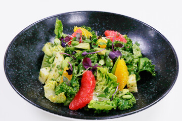 fresh vegetable salad with kale leaves, orange, grape fruit, apple, asparagus etc