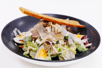 caesar salad romain lettuce, boiled egg, anchovy and bread cruton