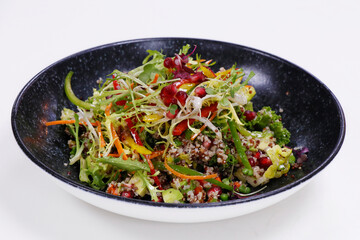quinoa salad with bell peppers, avocado, beans and carrots