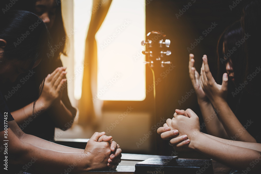 Wall mural group of people praying worship believe.