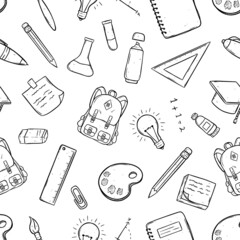 hand drawn school supplies in seamless pattern